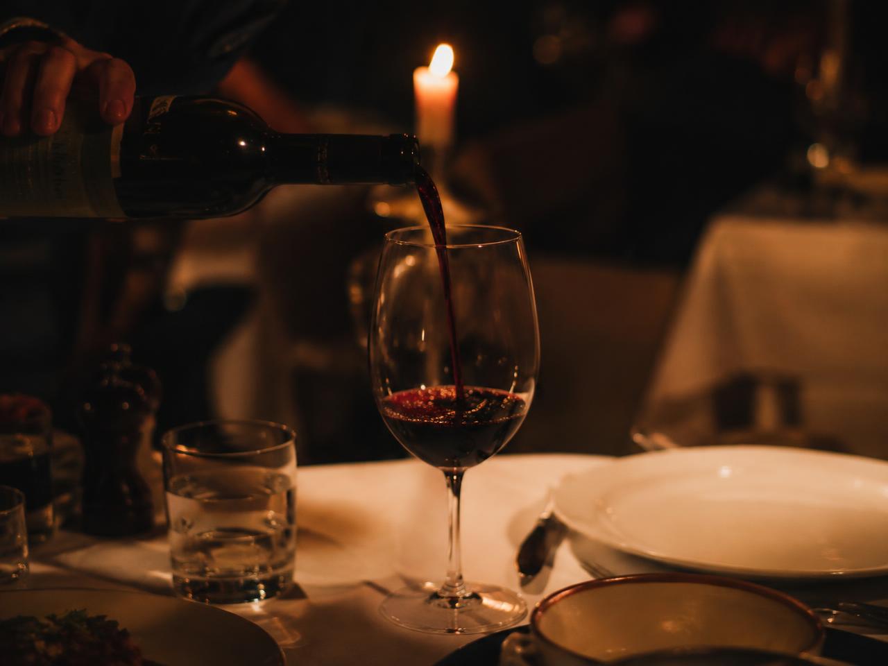 Red wine poured by candlelight (sample image)